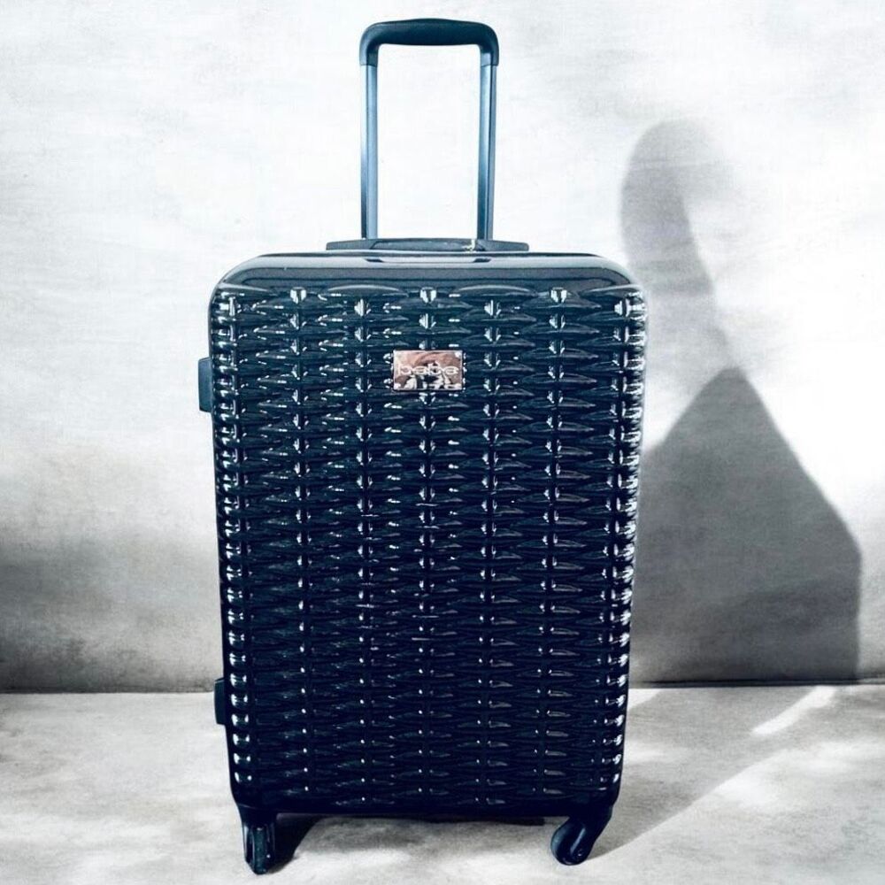 NWT Bebe Gorgeous 25” Lydia Black woven basketweave spinner hard shell Luggage